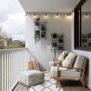 2 brown wooden armchairs beside white wall