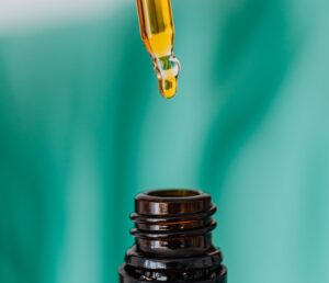 Brown glass bottle with liquid and pipette