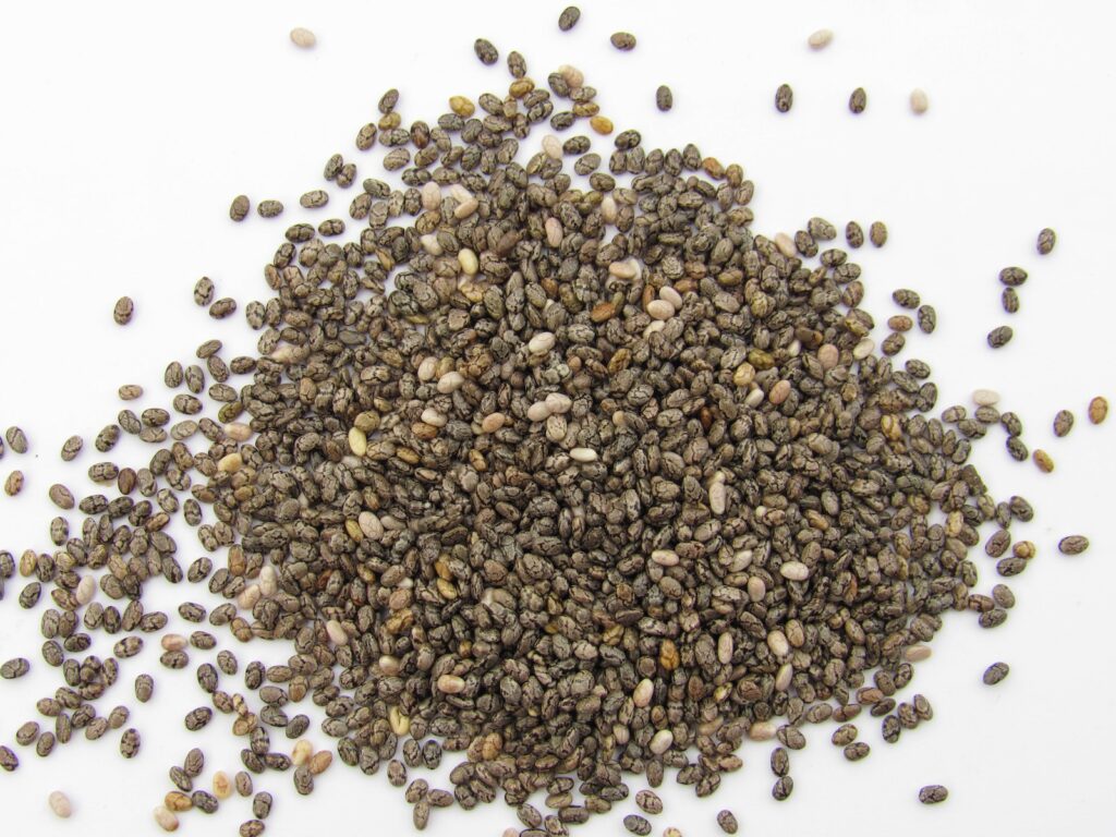 a pile of seeds on a white surface