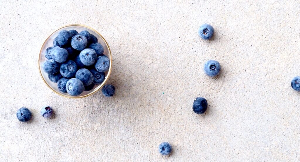 blueberries in clear glass bowl