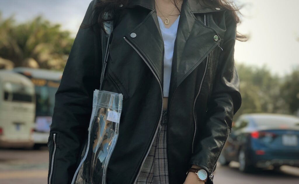 woman wearing black leather zip-up jacket