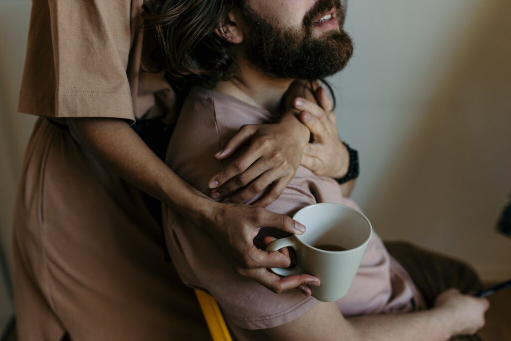 Photo Of A Man Being Hugged