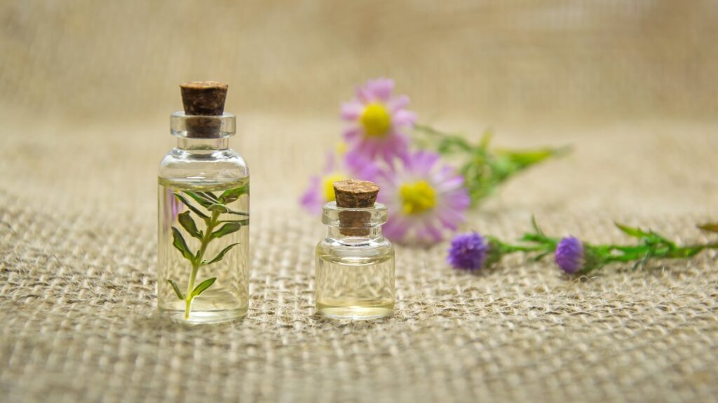 Two Clear Glass Bottles With Liquids