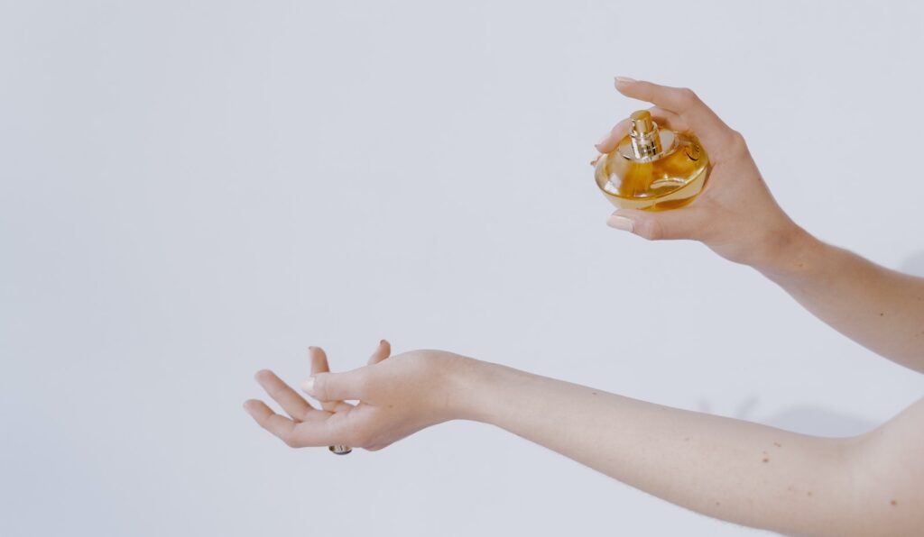 A Person Holding a Perfume Bottle