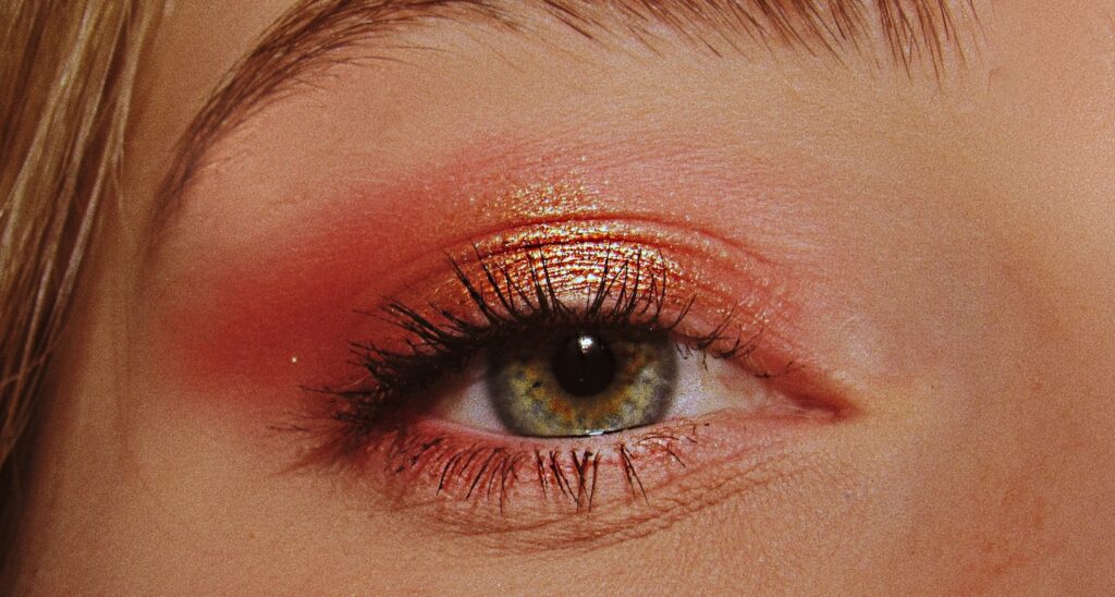 woman with pink and gold eyeshadow makeup