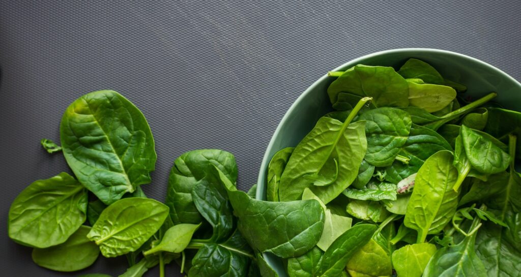 green leaves on white ceramic bowl