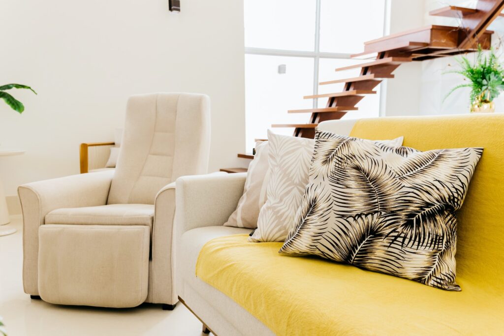 white and black zebra print throw pillow on white couch