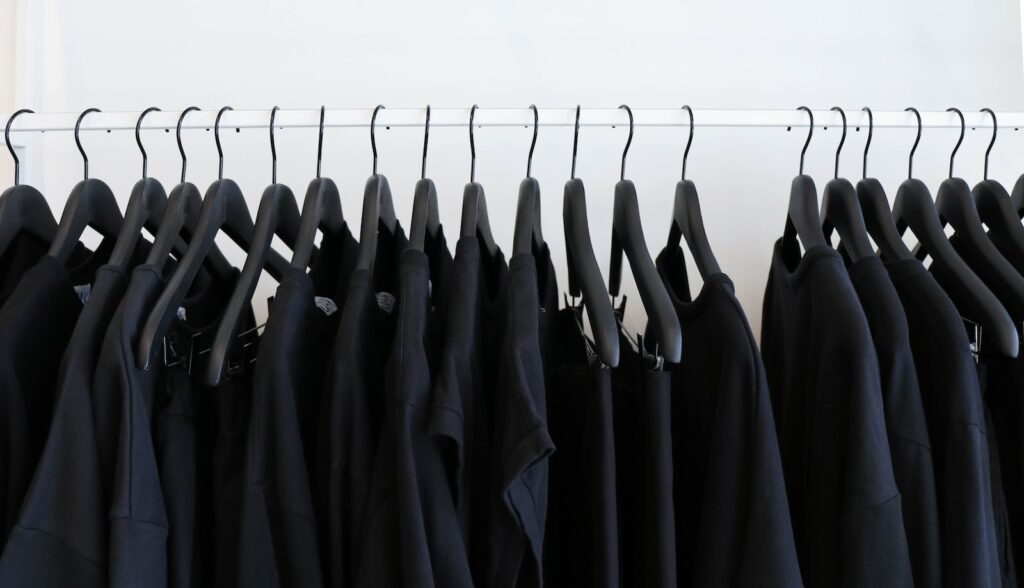 black clothes hanged in rack