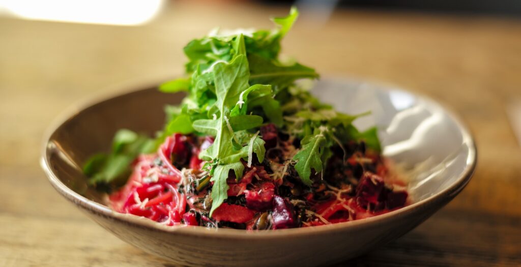 vegetable salad on brown ceramic bowl