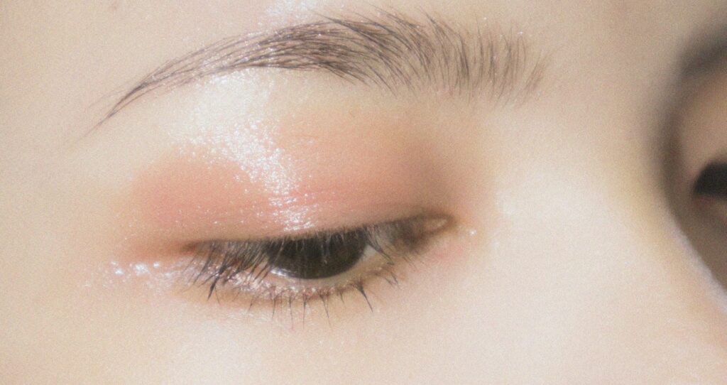 a close up of a woman's eye with makeup