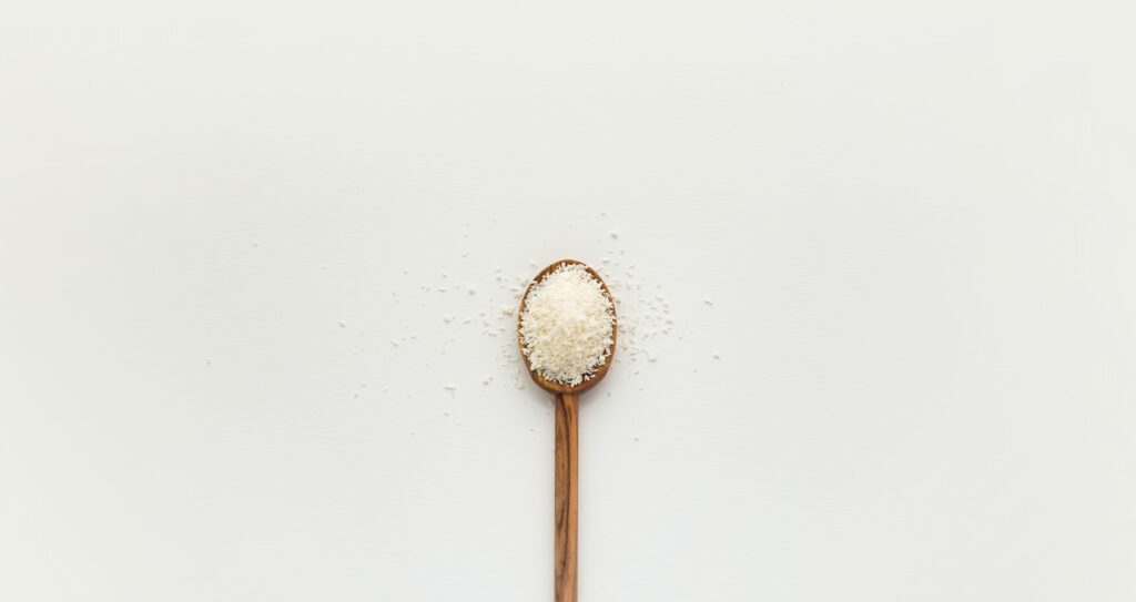 white powder on brown wooden spoon