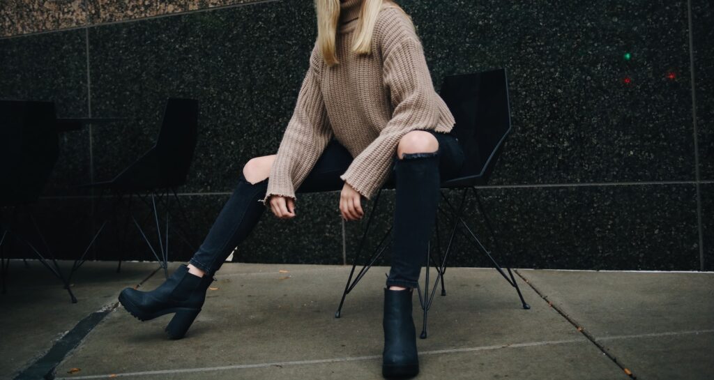 woman sitting on black chair