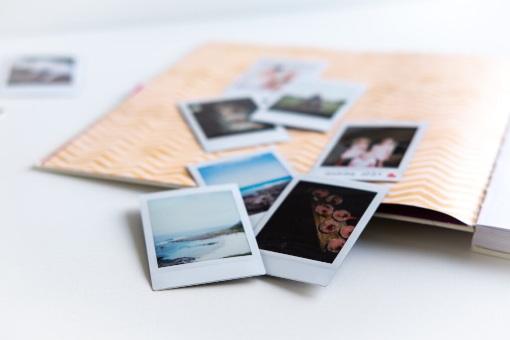 photos on white wooden table