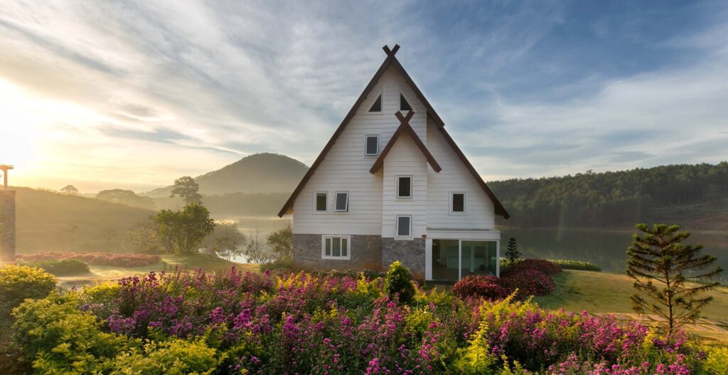 white and gray painted house with meadow of lavender