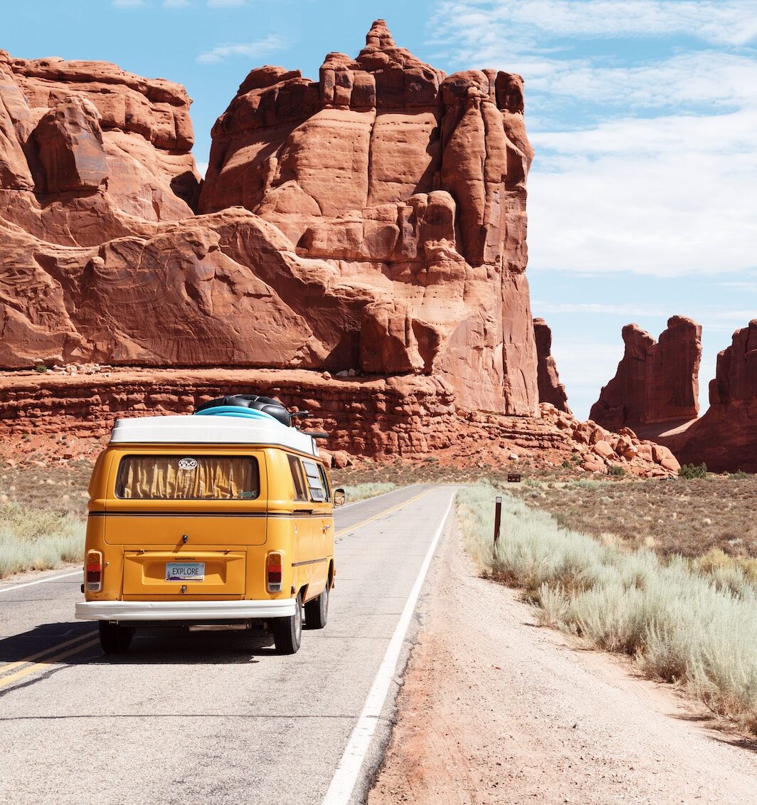 yellow Volkswagen van on road