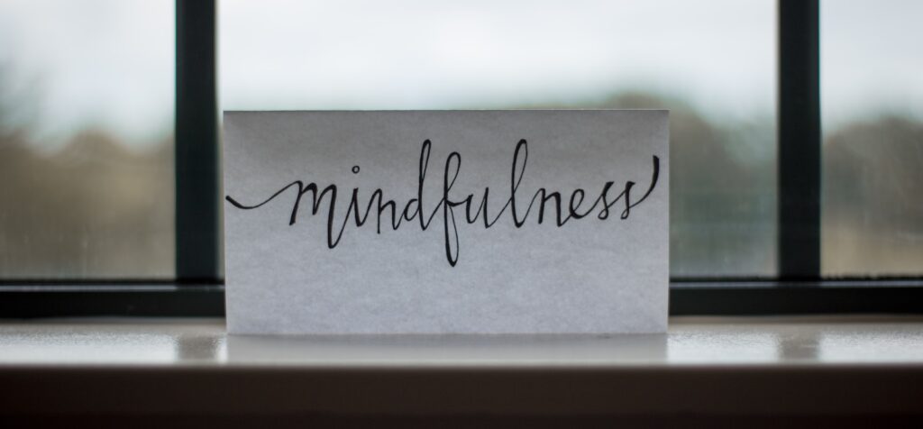 mindfulness printed paper near window