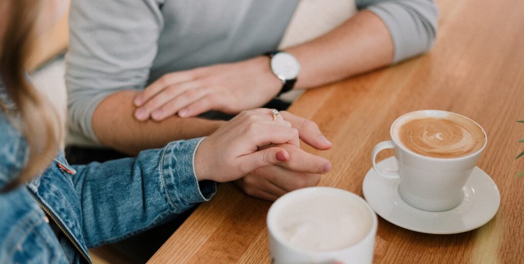 man and woman holding hands