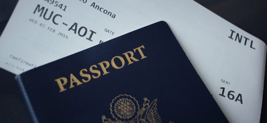 passport booklet on top of white paper