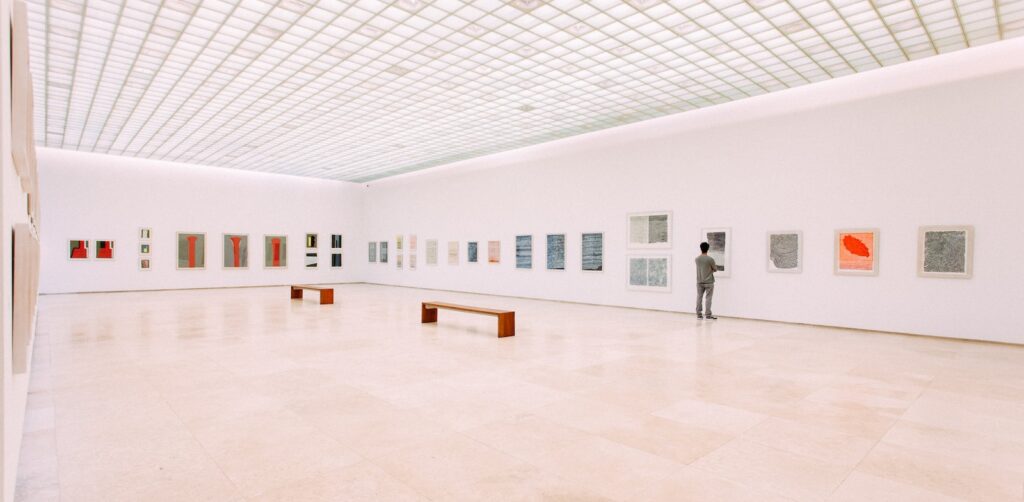 person looking at painting