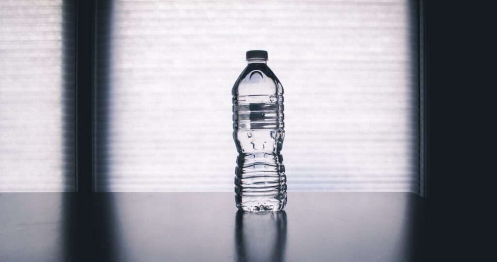 clear drinking bottle filled with water