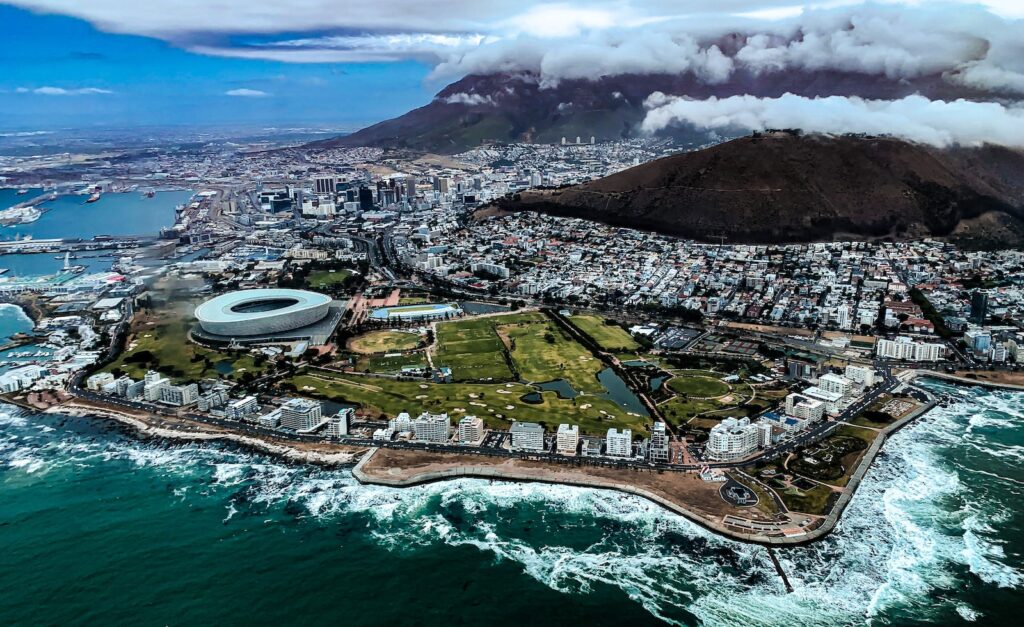 aerial view of city near body of water during daytime