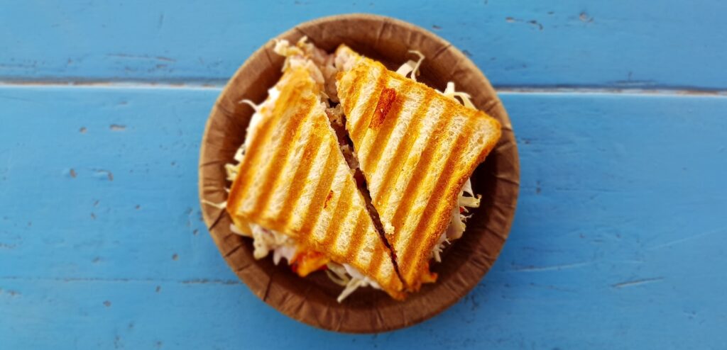 two slices of sandwich on brown container