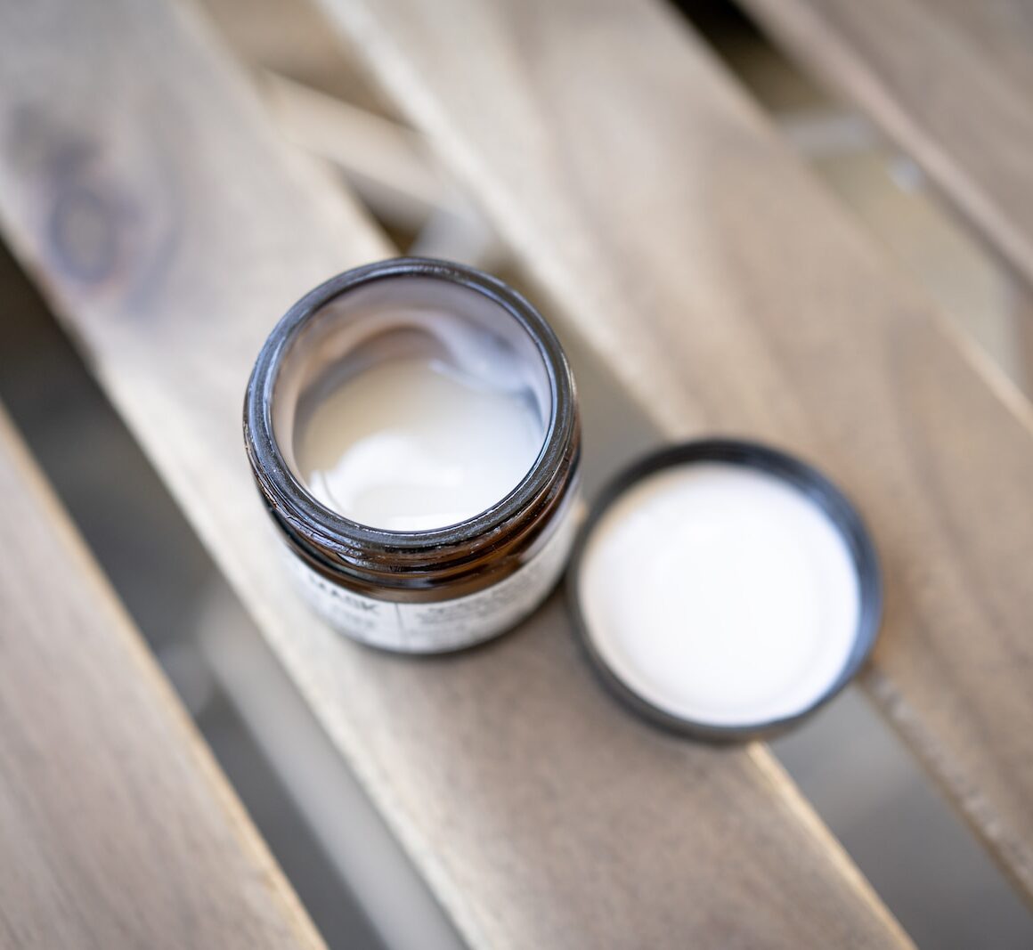 silver ring on brown wooden table