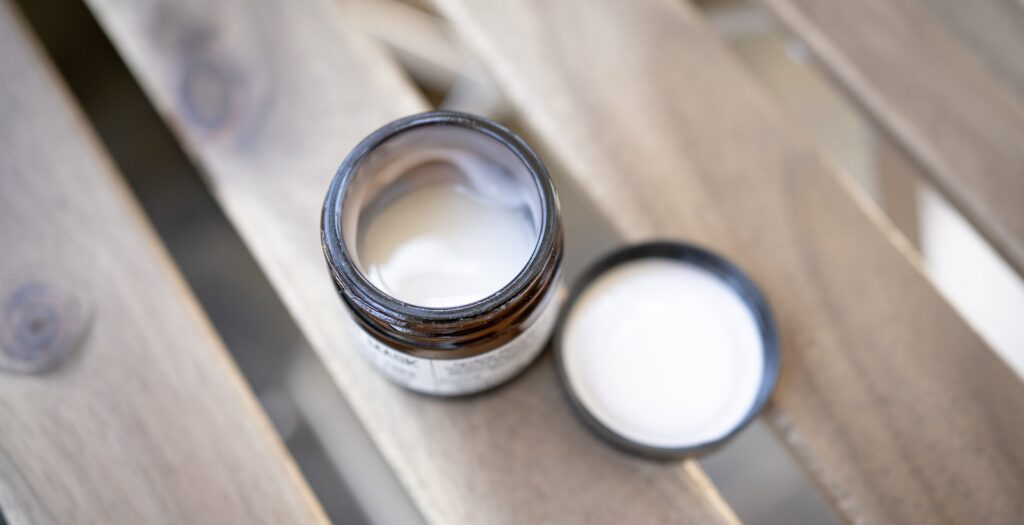 silver ring on brown wooden table