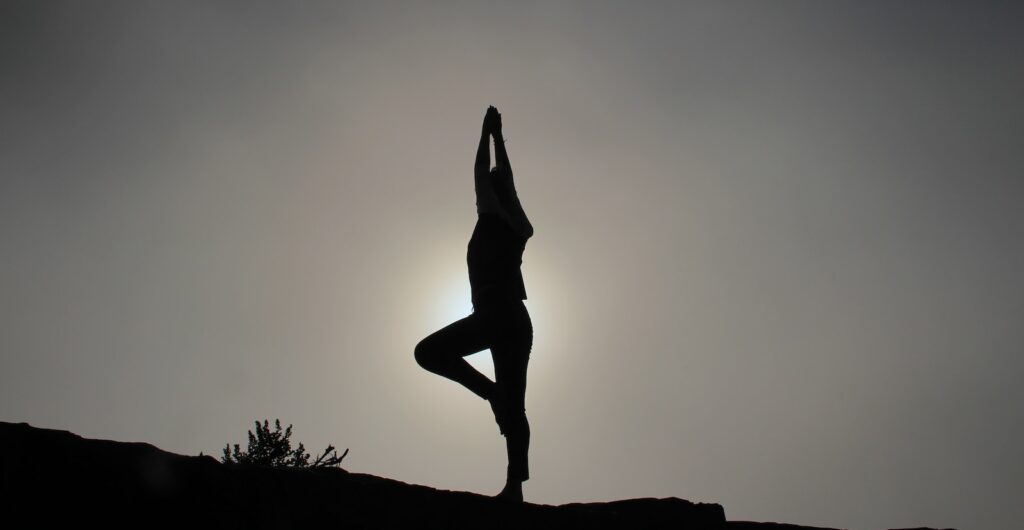 person doing yoga exercises