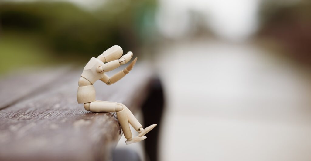 white plastic toy on brown wooden table