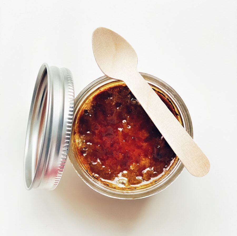 brown liquid in clear glass jar