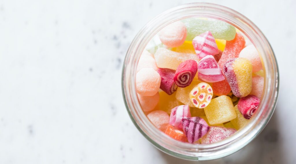 assorted-color candies on container