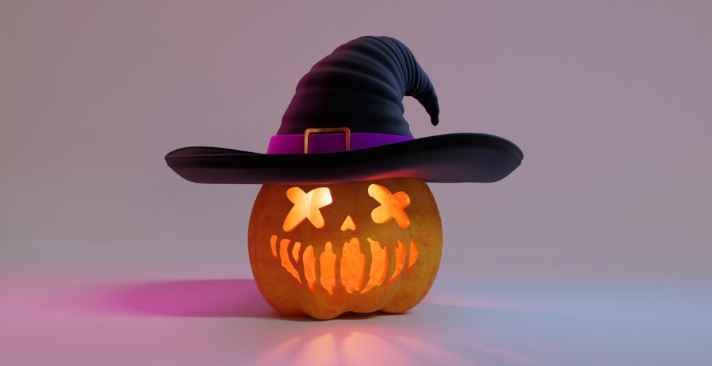 a halloween pumpkin with a witch hat on it