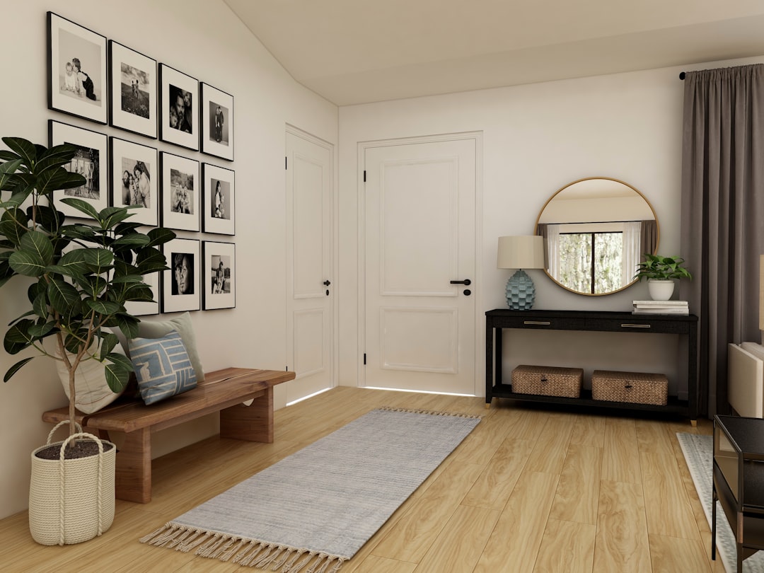 Alt text: cozy fall entryway featuring thrift store finds like a wool throw, brass candlesticks, and a woven basket
