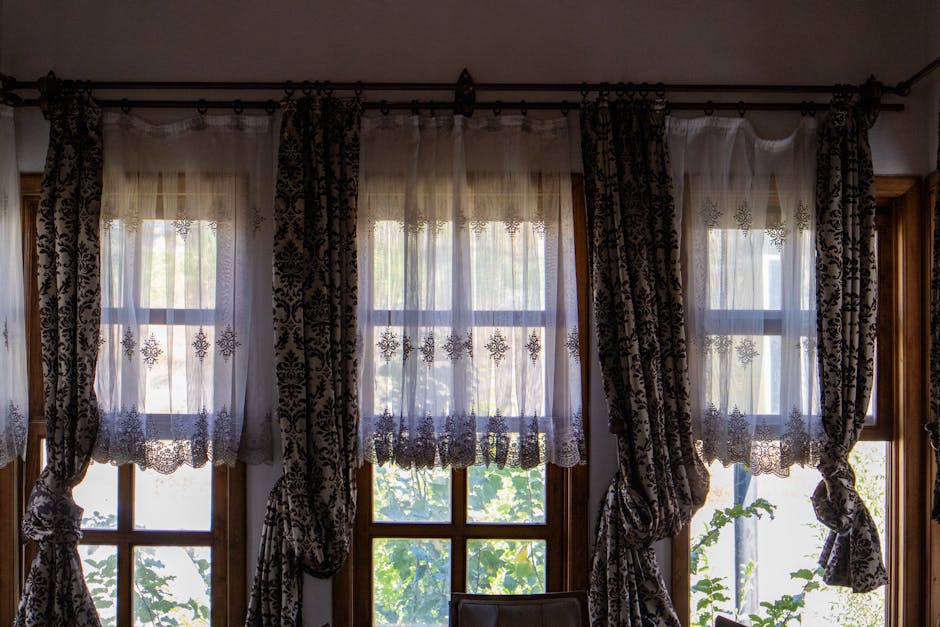 Alt text: double curtain rod setup for cozy fall window layers