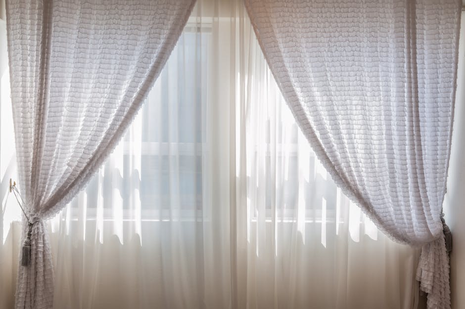 Alt text: double curtain rod with sheers and heavy drapes for cozy fall window layers