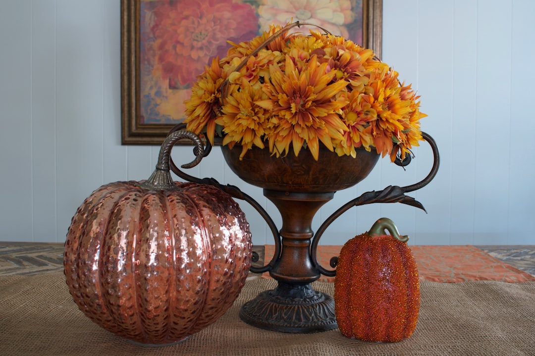 Alt text: fall entryway table styled with thrifted decor using the rule of thirds