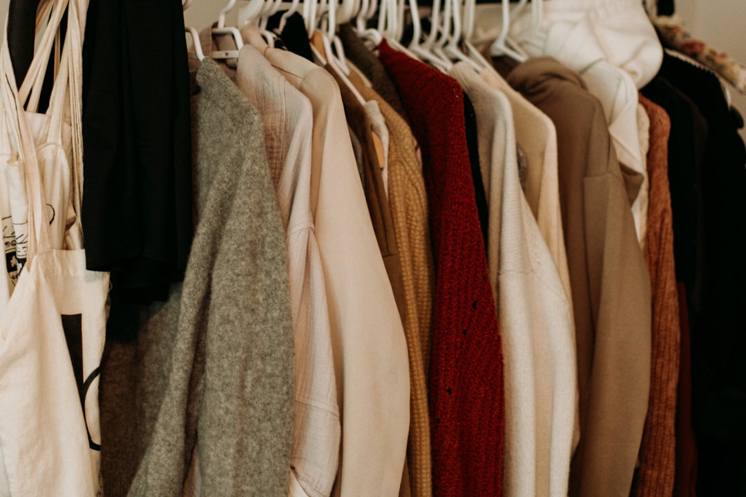 Alt text: Organized layering pieces hanging in closet for easy access