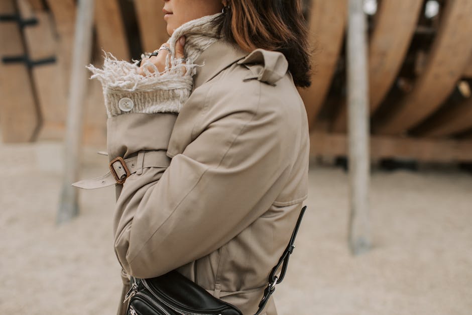 Alt text: Neutral fall accessories including scarf belt and bag in taupe and cream for layered neutrals