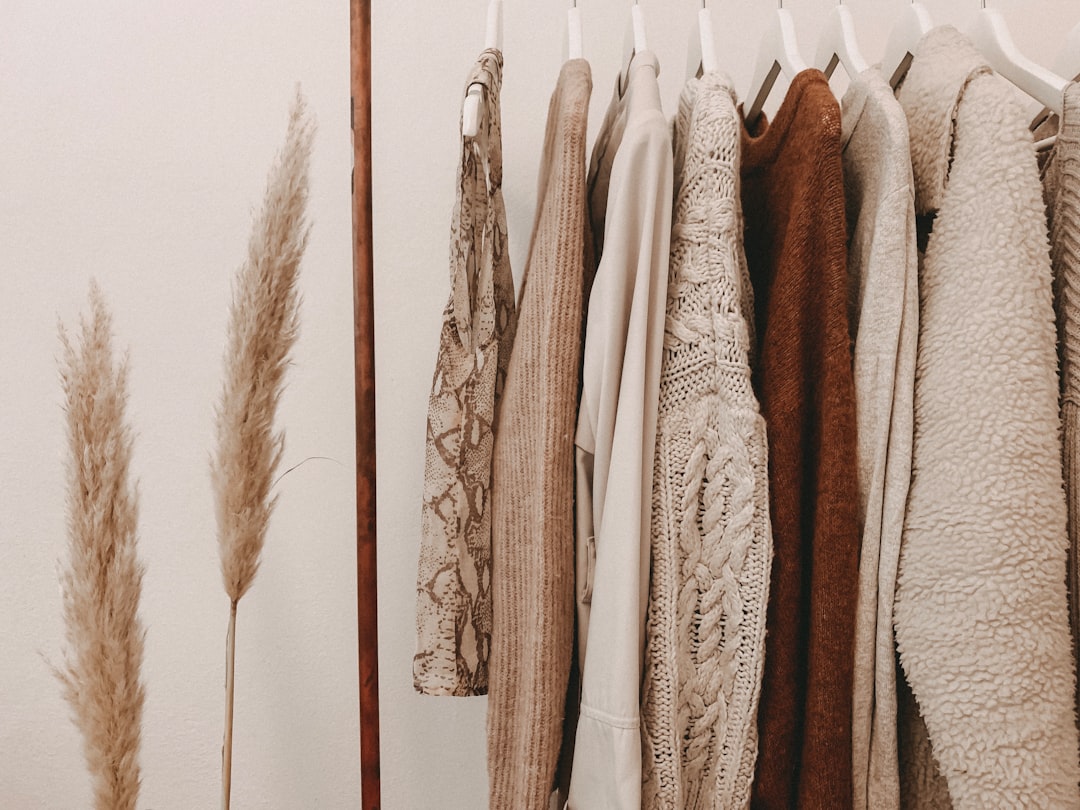 Alt text: Neutral layering guide showing base middle and outer layers for fall wardrobe