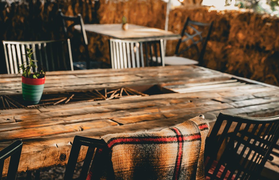 Alt text: plaid blanket on porch chair for fall season