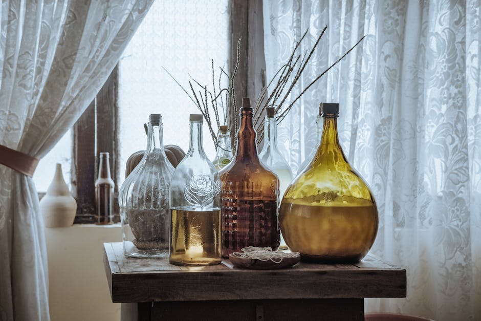 Alt text: vintage copper pot and amber glass bottles on thrift store shelf