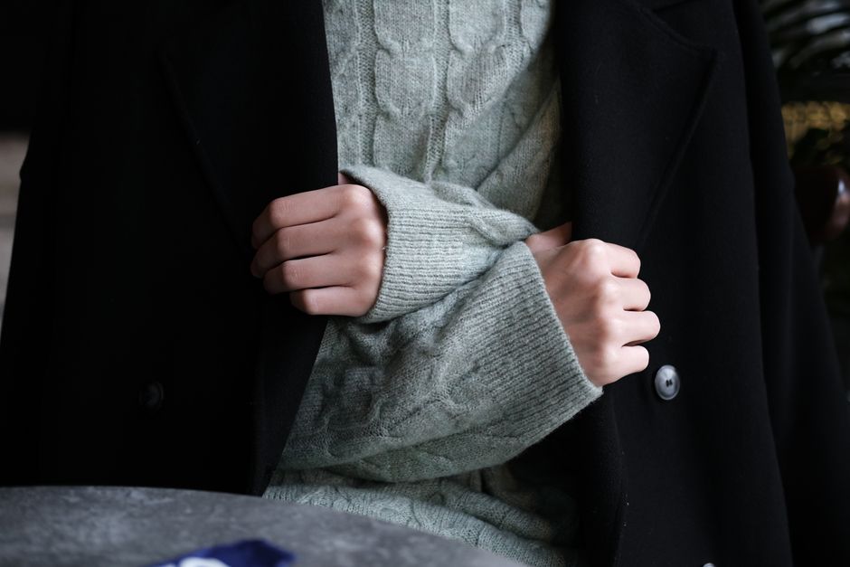 Outerwear over layered knits and turtlenecks for extreme cold