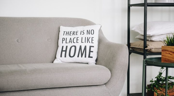 white throw pillow on gray sofa